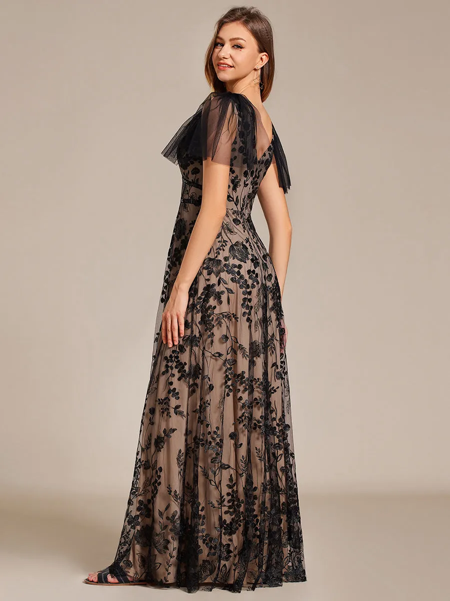 Robe longue de soirée en maille brodée à manches évasées