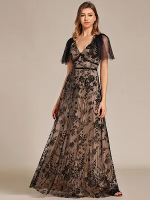 Robe longue de soirée en maille brodée à manches évasées