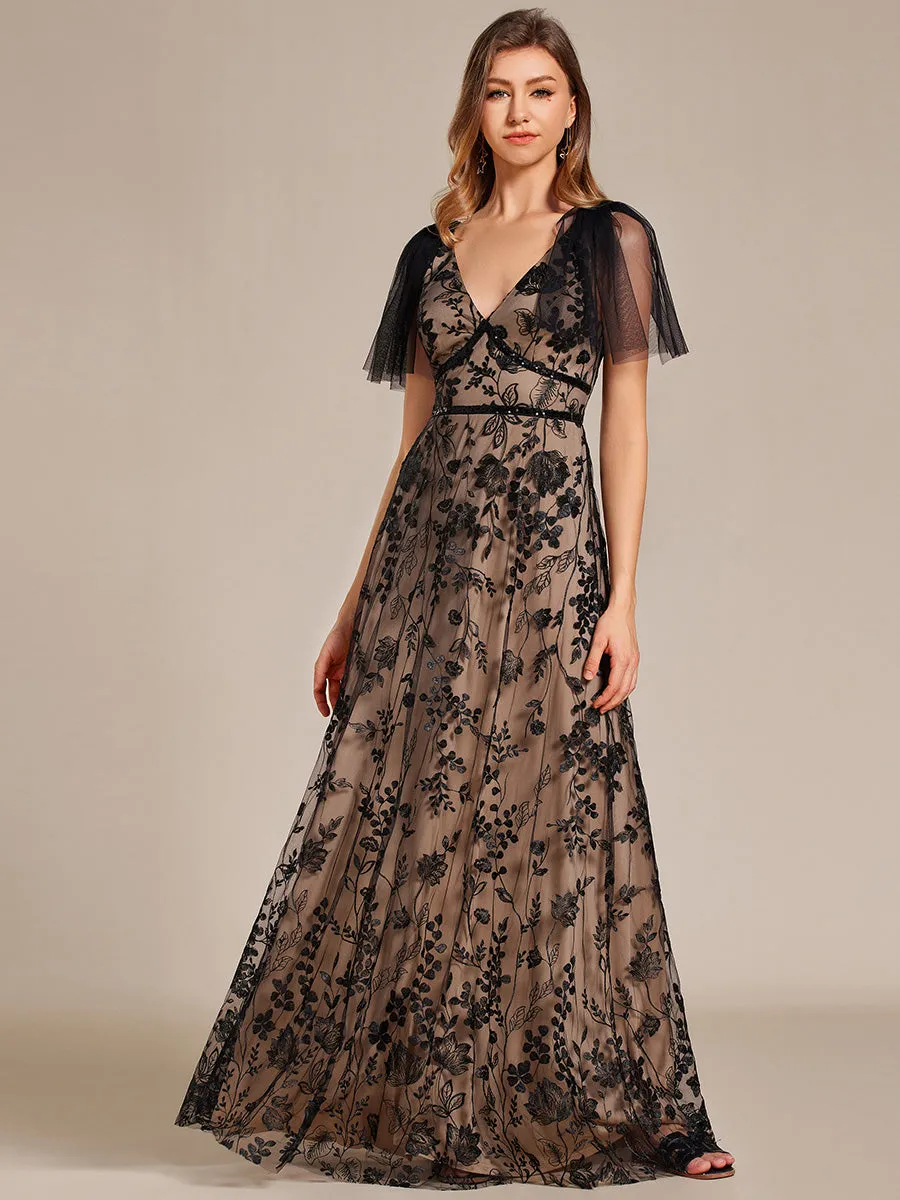 Robe longue de soirée en maille brodée à manches évasées